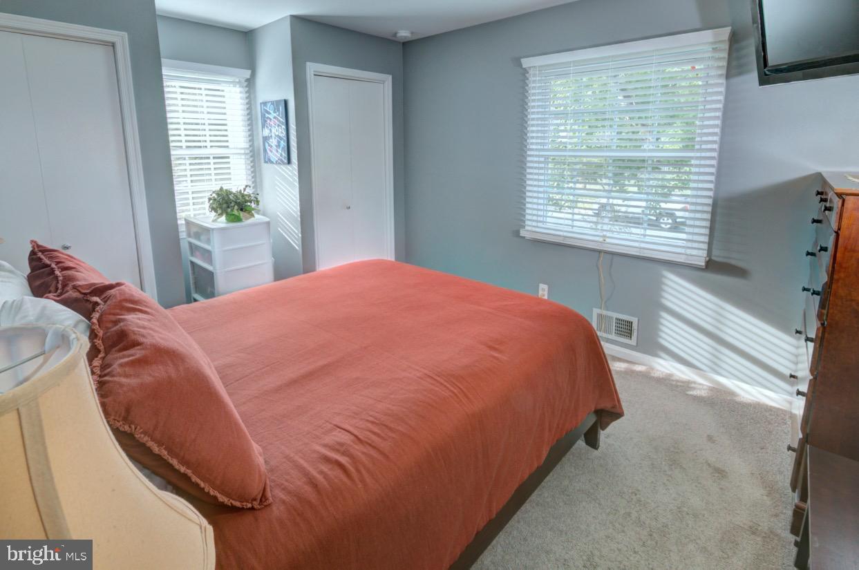 9015 Horton Road Laurel, MD 20708 - Photo 23 of 33 a bed sitting in a bedroom next to a window