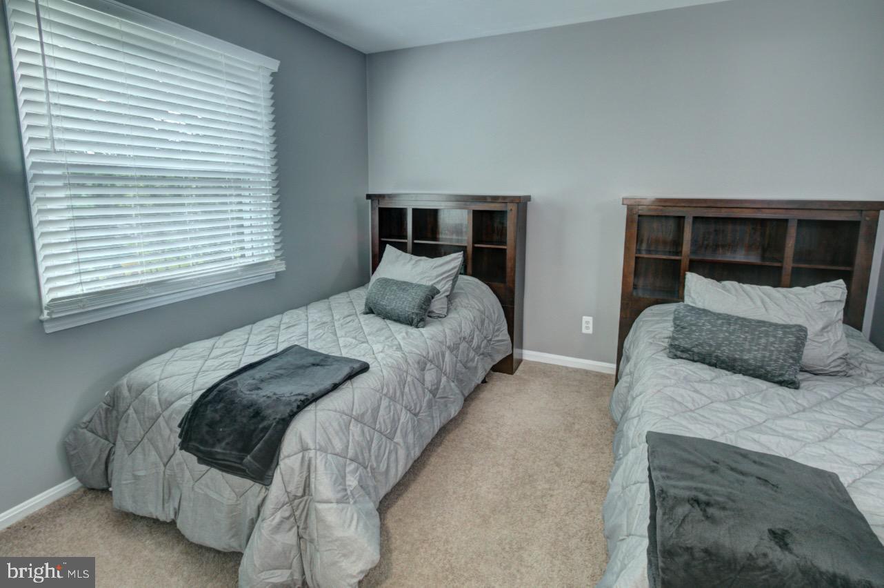 9015 Horton Road Laurel, MD 20708 - Photo 25 of 33 a bedroom with a large bed and a window