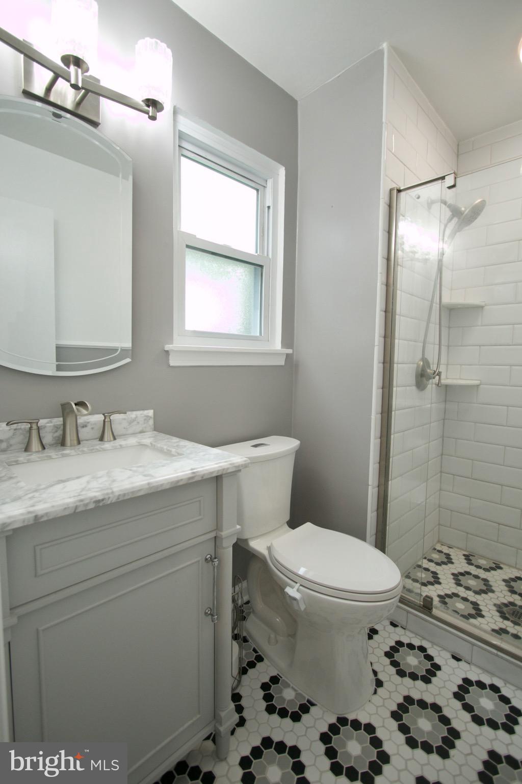 9015 Horton Road Laurel, MD 20708 - Photo 29 of 33 a bathroom with a sink toilet and shower