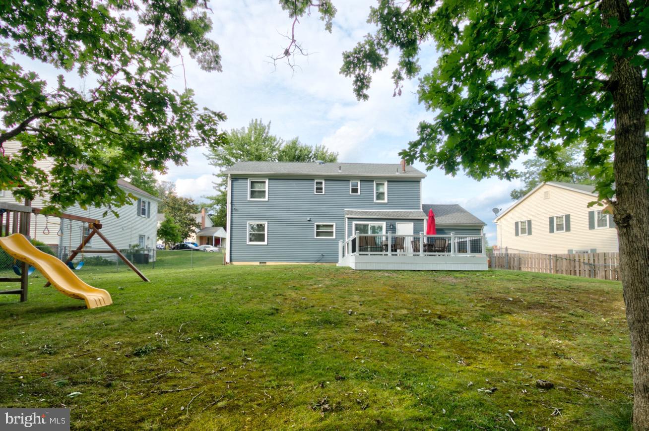9015 Horton Road Laurel, MD 20708 - Photo 6 of 33 a front view of a house with a yard and a tree