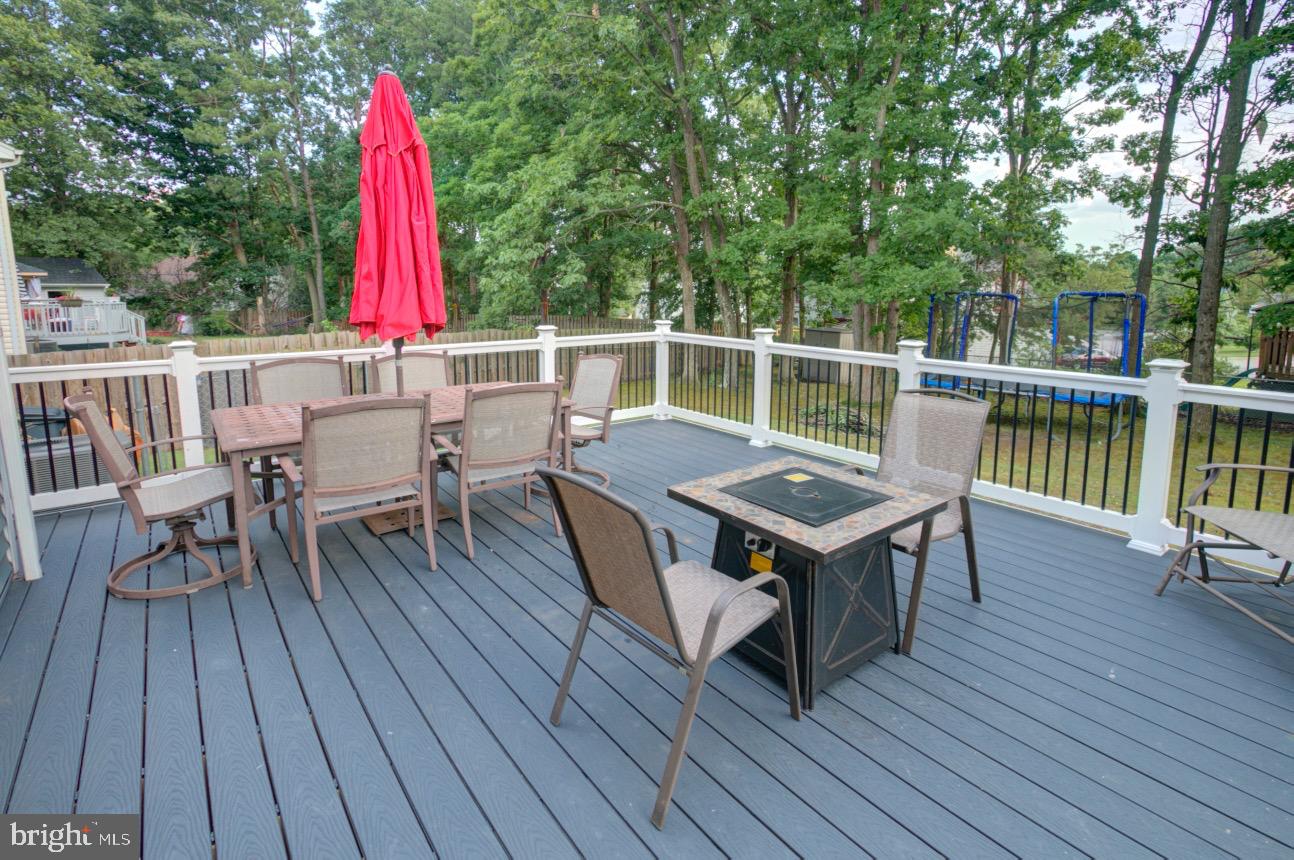 9015 Horton Road Laurel, MD 20708 - Photo 8 of 33 a view of a chairs and table on the wooden deck