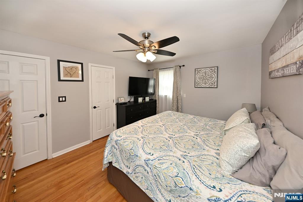 39 Niagara Street Dumont, NJ 07628 - Photo 15 of 40 a bedroom with a bed and a flat screen tv