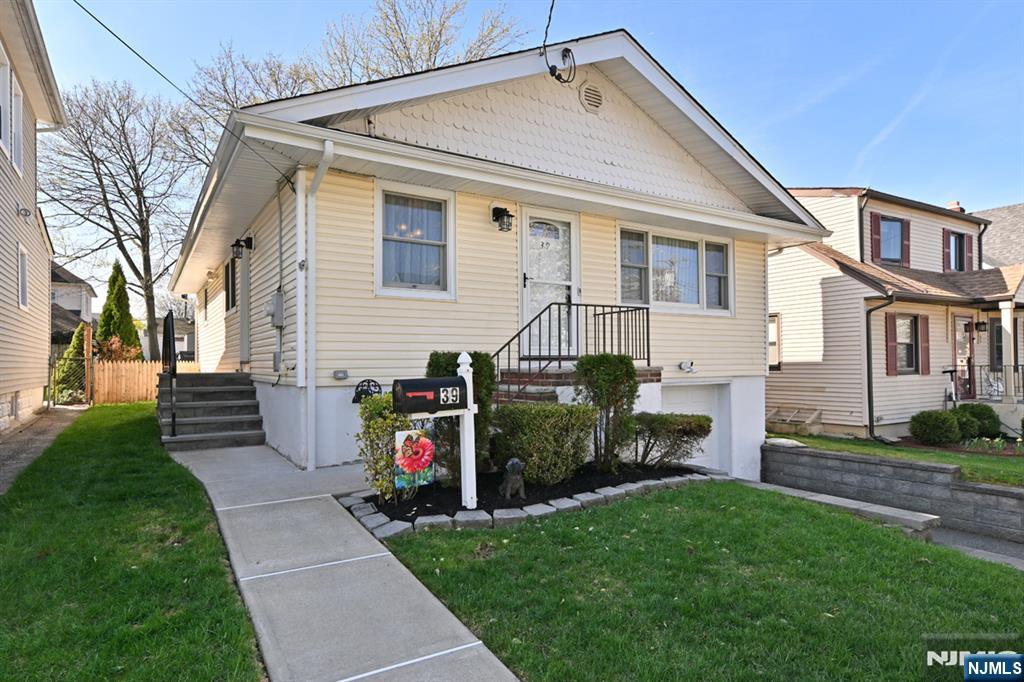 39 Niagara Street Dumont, NJ 07628 - Photo 2 of 40 a front view of house with yard and green space