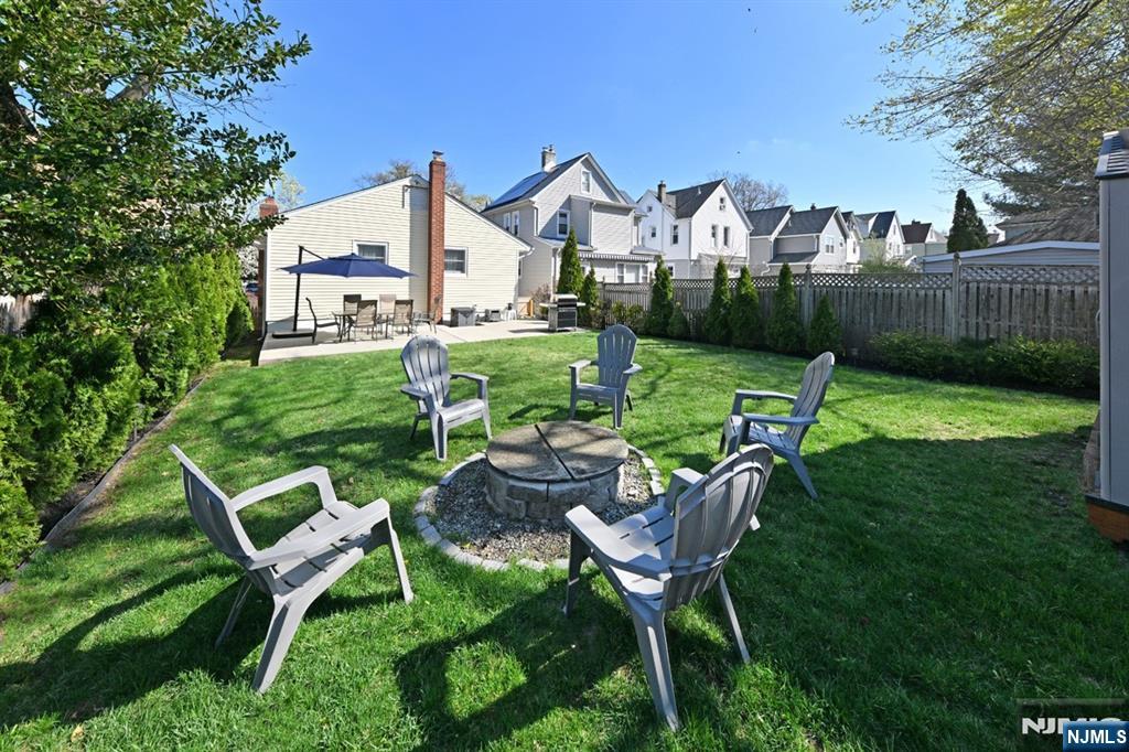 39 Niagara Street Dumont, NJ 07628 - Photo 22 of 40 a view of a chair and table in backyard of the house