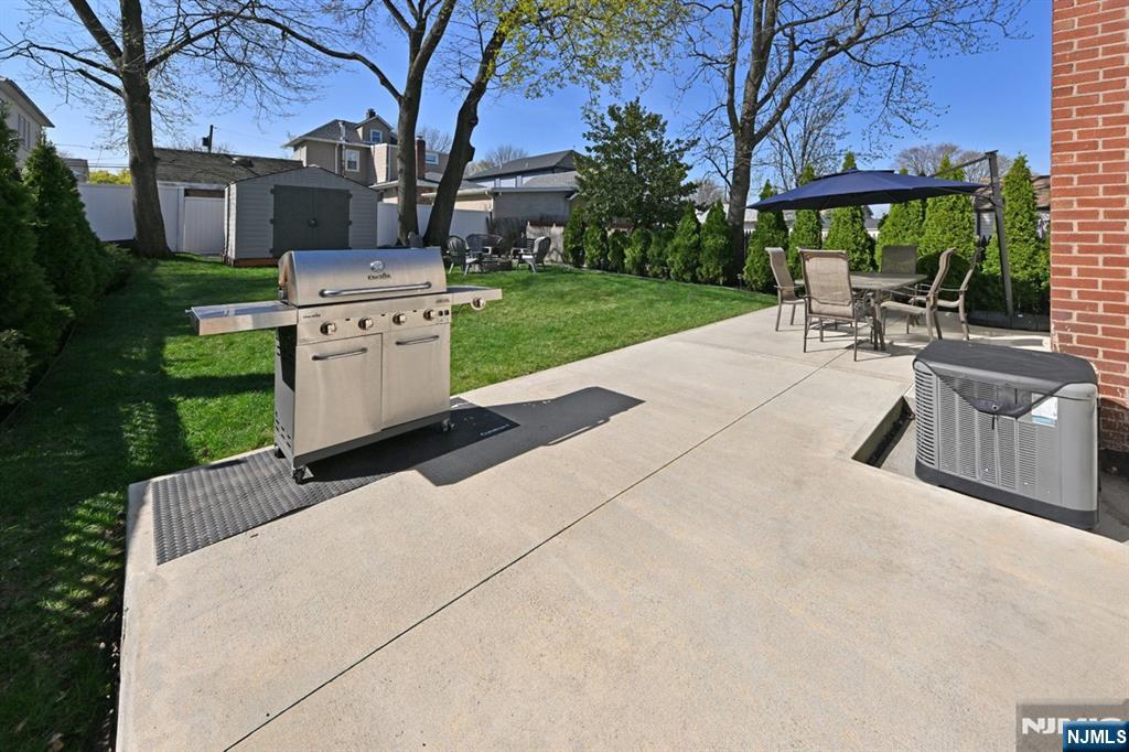 39 Niagara Street Dumont, NJ 07628 - Photo 25 of 40 a view of backyard with outdoor seating and green space