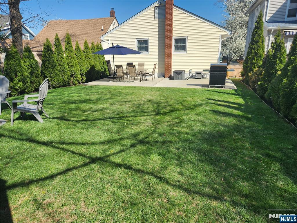 39 Niagara Street Dumont, NJ 07628 - Photo 29 of 40 a view of a house with a yard and sitting area