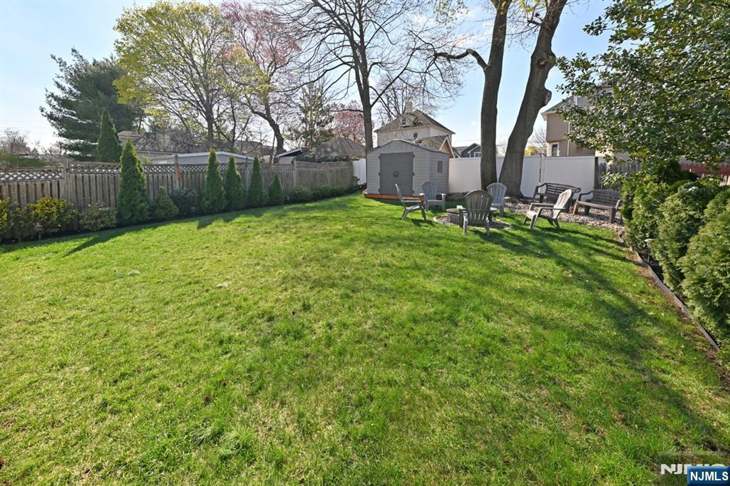 39 Niagara Street Dumont, NJ 07628 - Photo 3 of 40 a backyard of a house with lots of green space