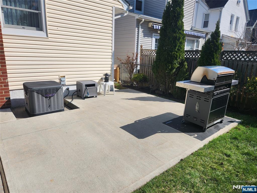 39 Niagara Street Dumont, NJ 07628 - Photo 31 of 40 a view of a backyard with chairs and a barbeque