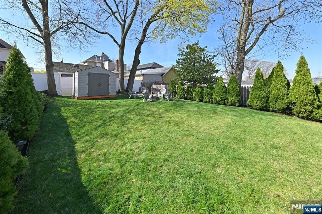 39 Niagara Street Dumont, NJ 07628 - Photo 4 of 40 a view of a backyard with large trees