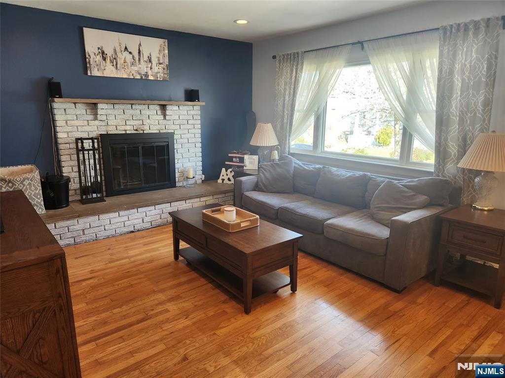 39 Niagara Street Dumont, NJ 07628 - Photo 8 of 40 a living room with furniture and a fireplace