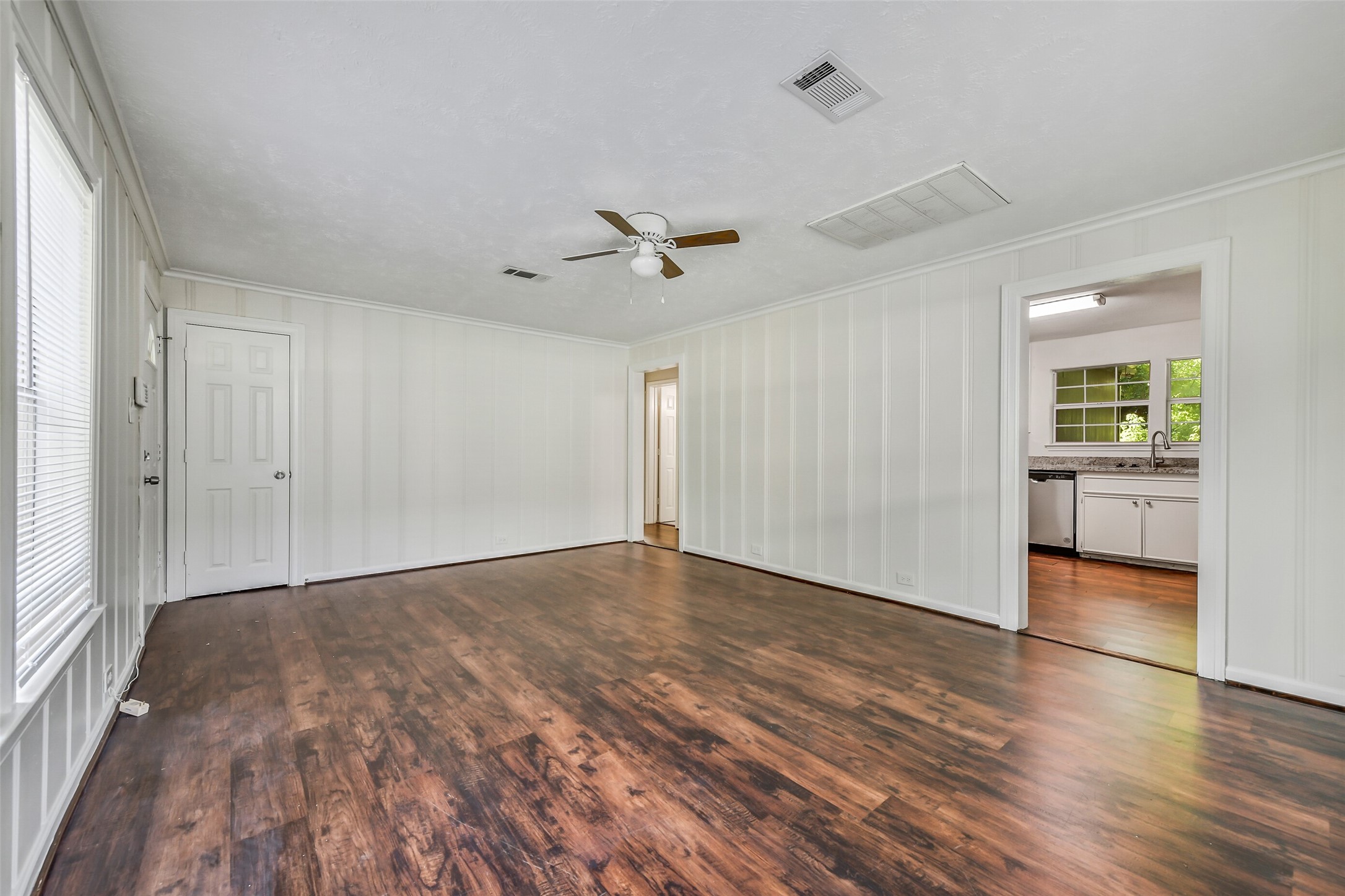 809 Chestnut Street La Marque, TX 77568 - Photo 4 of 25 Low maintenance laminate flooring is found throughout each common space.