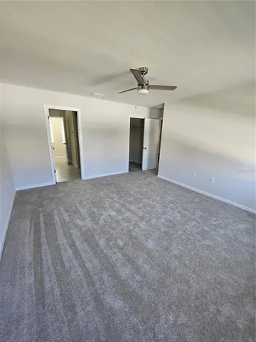 a view of empty room with a fireplace