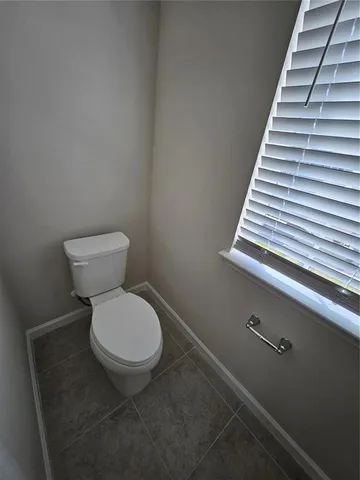 a bathroom with a double vanity sink mirror and bathtub