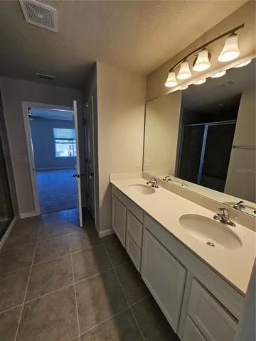 a bathroom with a shower and a bath tub