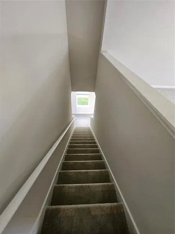 a view of an chairs and backyard of the house