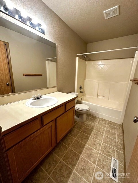 3419 Bittersweet Street Southeast Olympia, WA 98501 - Photo 14 of 15 a bathroom with a double vanity sink mirror and toilet