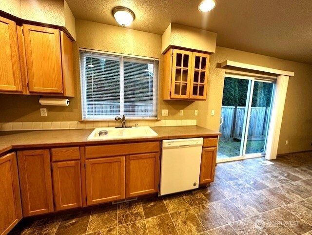 3419 Bittersweet Street Southeast Olympia, WA 98501 - Photo 5 of 15 a kitchen with stainless steel appliances granite countertop a sink and a cabinets