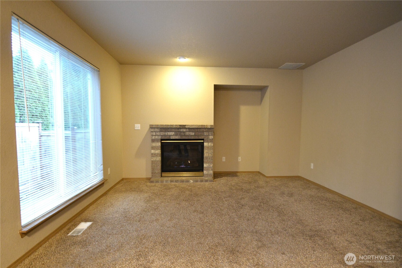 3419 Bittersweet Street Southeast Olympia, WA 98501 - Photo 8 of 15 an empty room with a fireplace