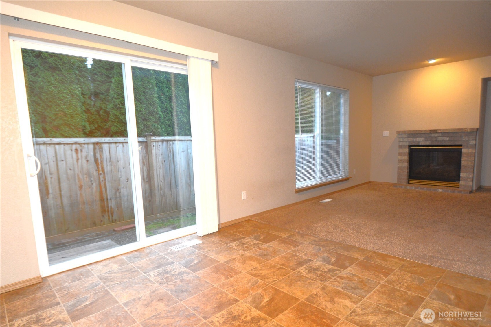 3419 Bittersweet Street Southeast Olympia, WA 98501 - Photo 9 of 15 a view of an empty room with a window and fire place