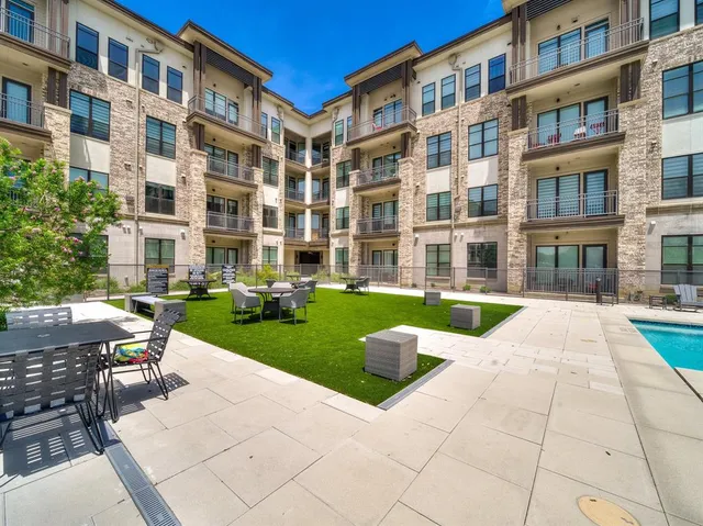 a view of a building with sitting area