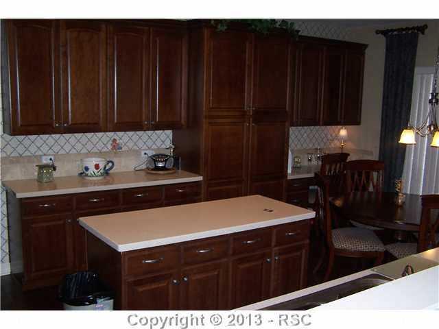 812 Spectrum Loop Colorado Springs, CO 80921 - Photo 2 of 17 Tons of cabinet space and solid surface counters.