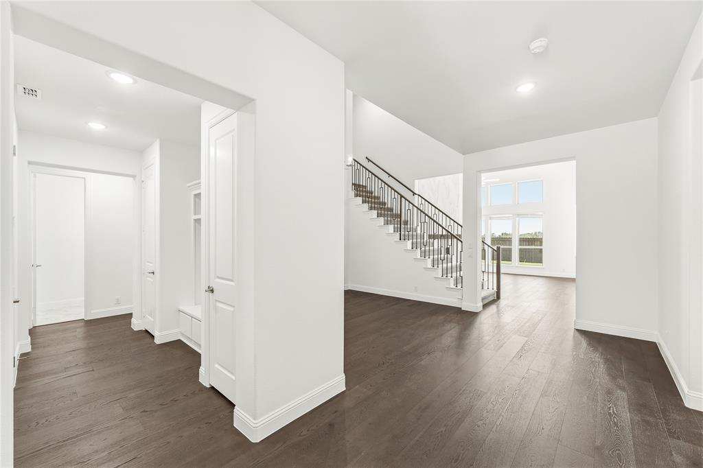 1145 Hitching Post Way Oak Point, TX 75068 - Photo 9 of 39 a view of an entryway with wooden floor