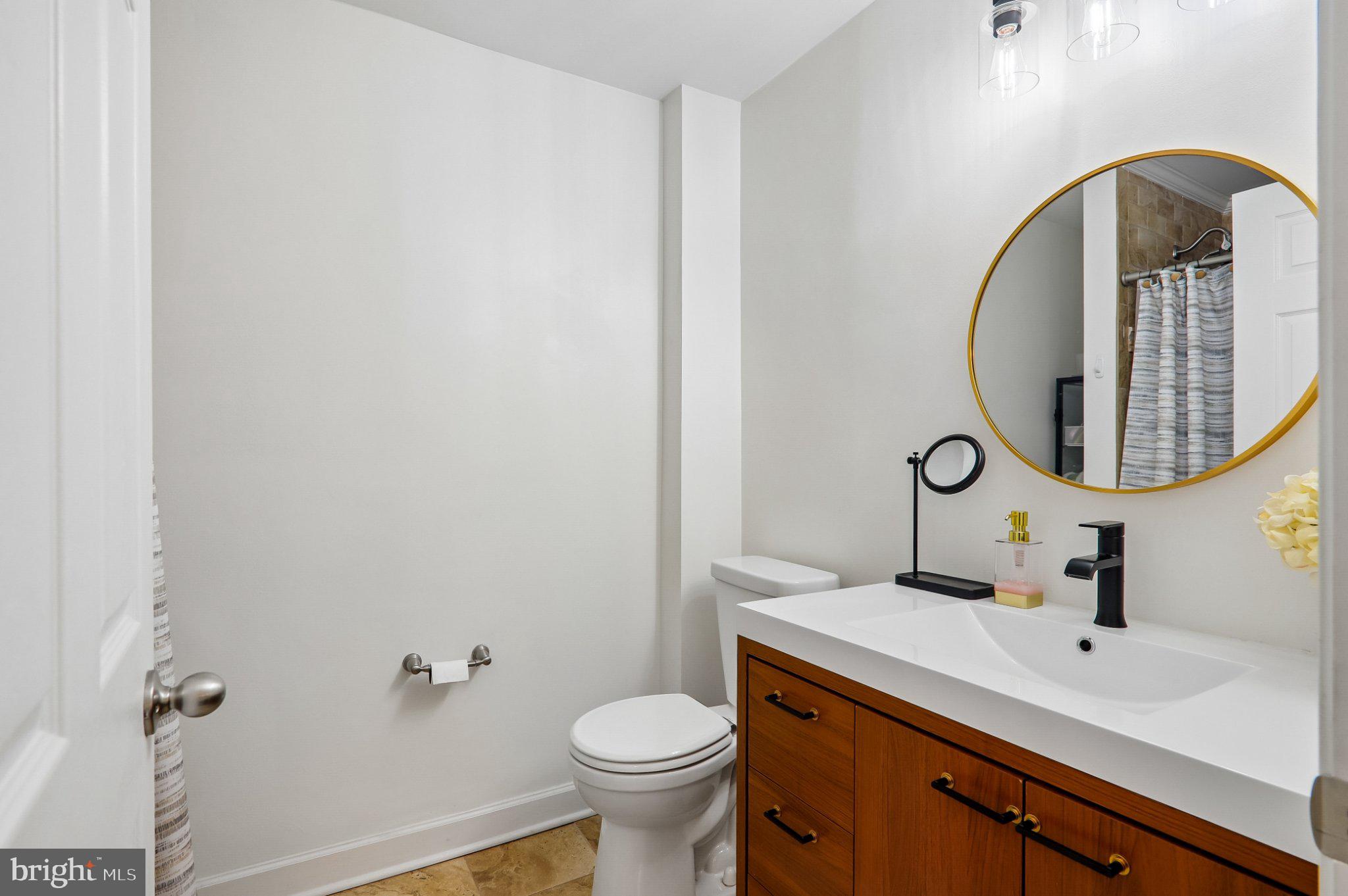3103 Walnut Street Northeast Washington, DC 20018 - Photo 33 of 40 Modern elegance in a cozy bathroom.