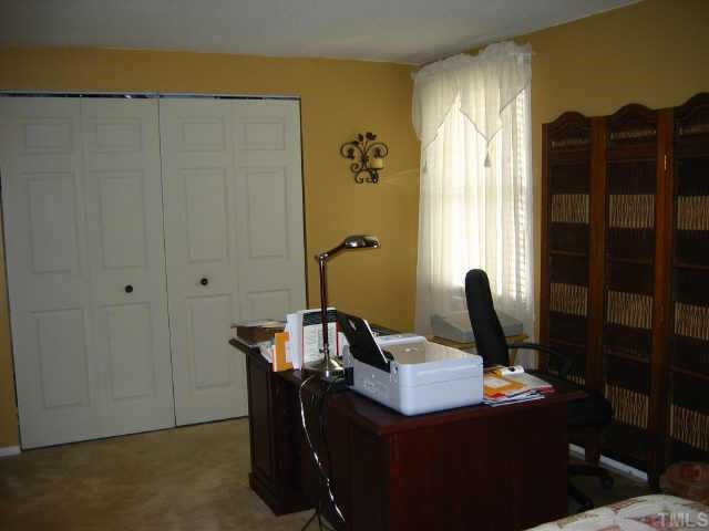 7707 Sandra Lane Raleigh, NC 27615 - Photo 10 of 12 2nd bedroom is used for bedroom/office w/large closet across back wall. Other