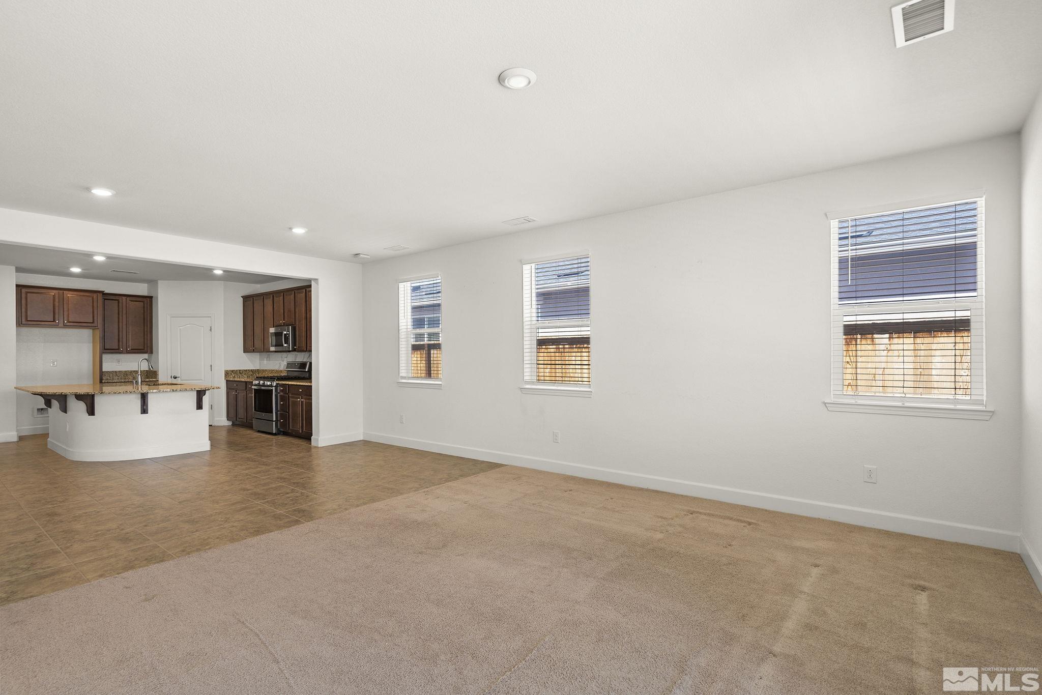 7360 Continuum Drive Reno, NV 89506 - Photo 11 of 28 an empty room with furniture and natural light