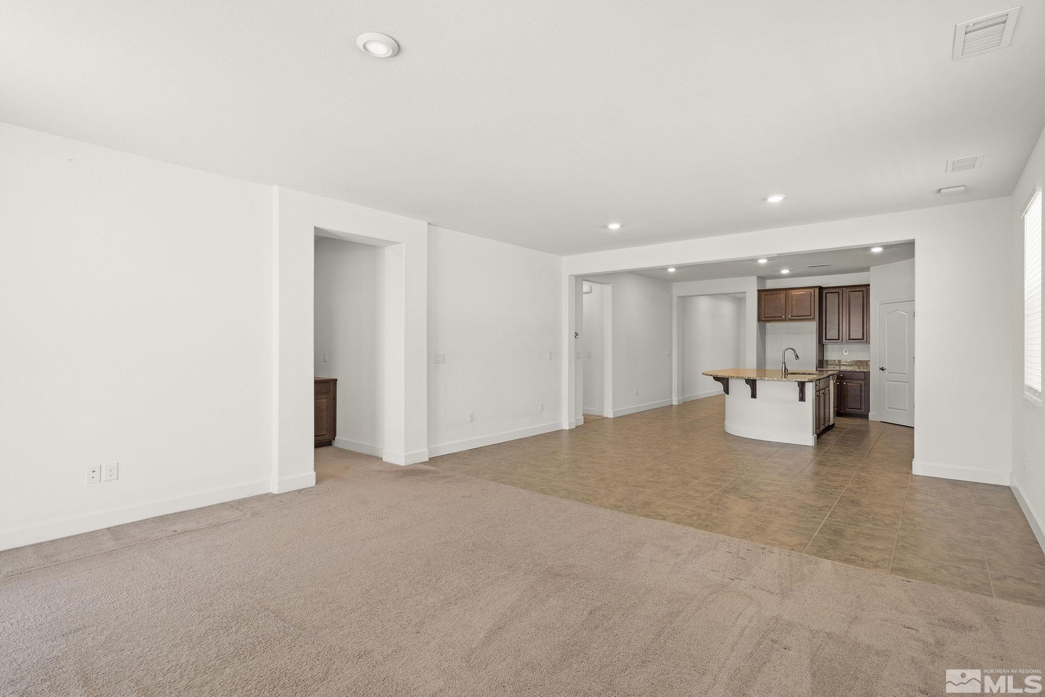 7360 Continuum Drive Reno, NV 89506 - Photo 14 of 28 a view of an empty room with kitchen