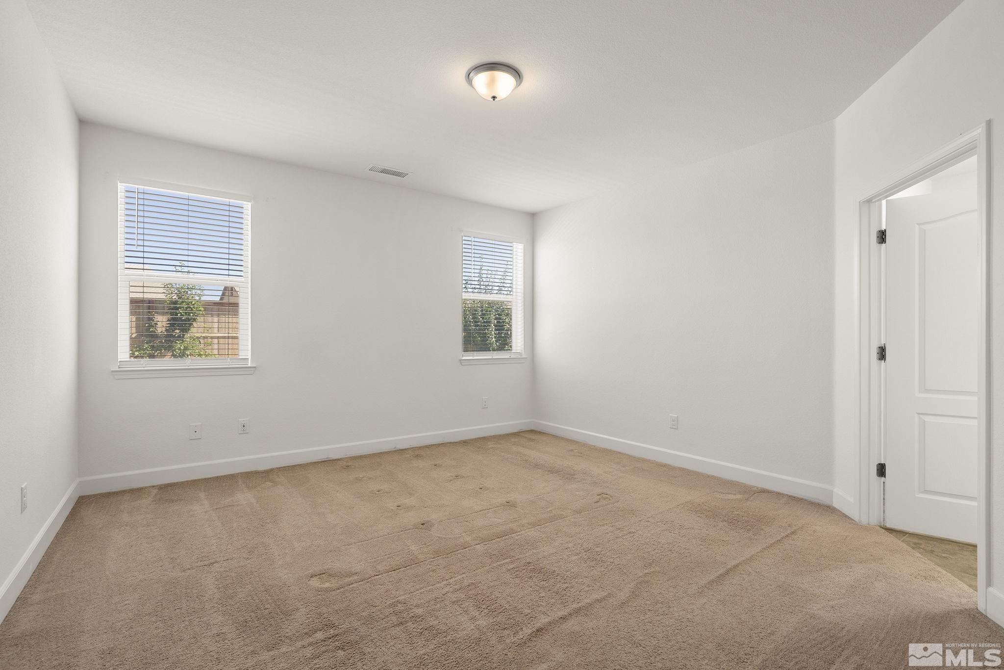7360 Continuum Drive Reno, NV 89506 - Photo 16 of 28 an empty room with windows