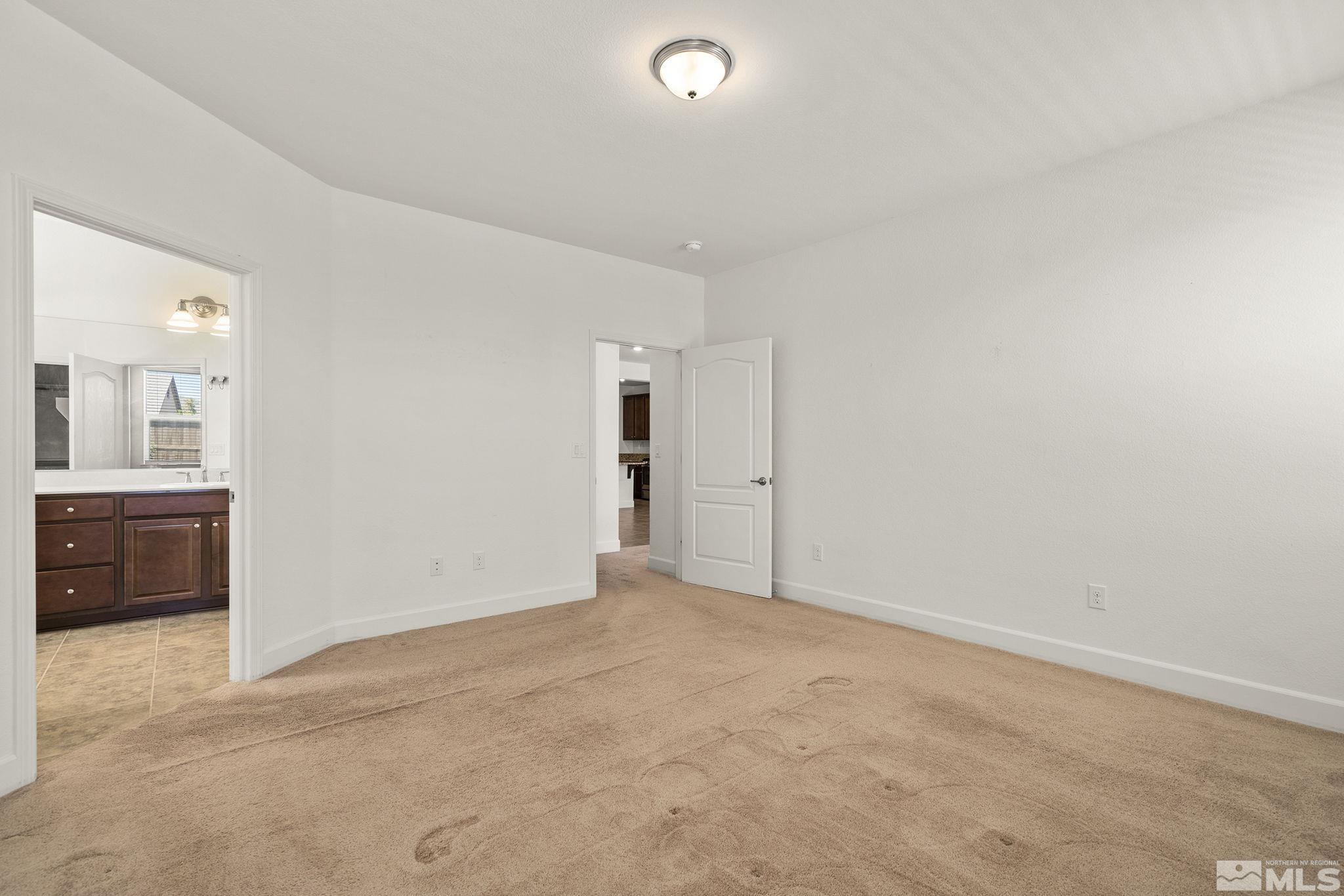 7360 Continuum Drive Reno, NV 89506 - Photo 17 of 28 an empty room with a bathroom and a sink