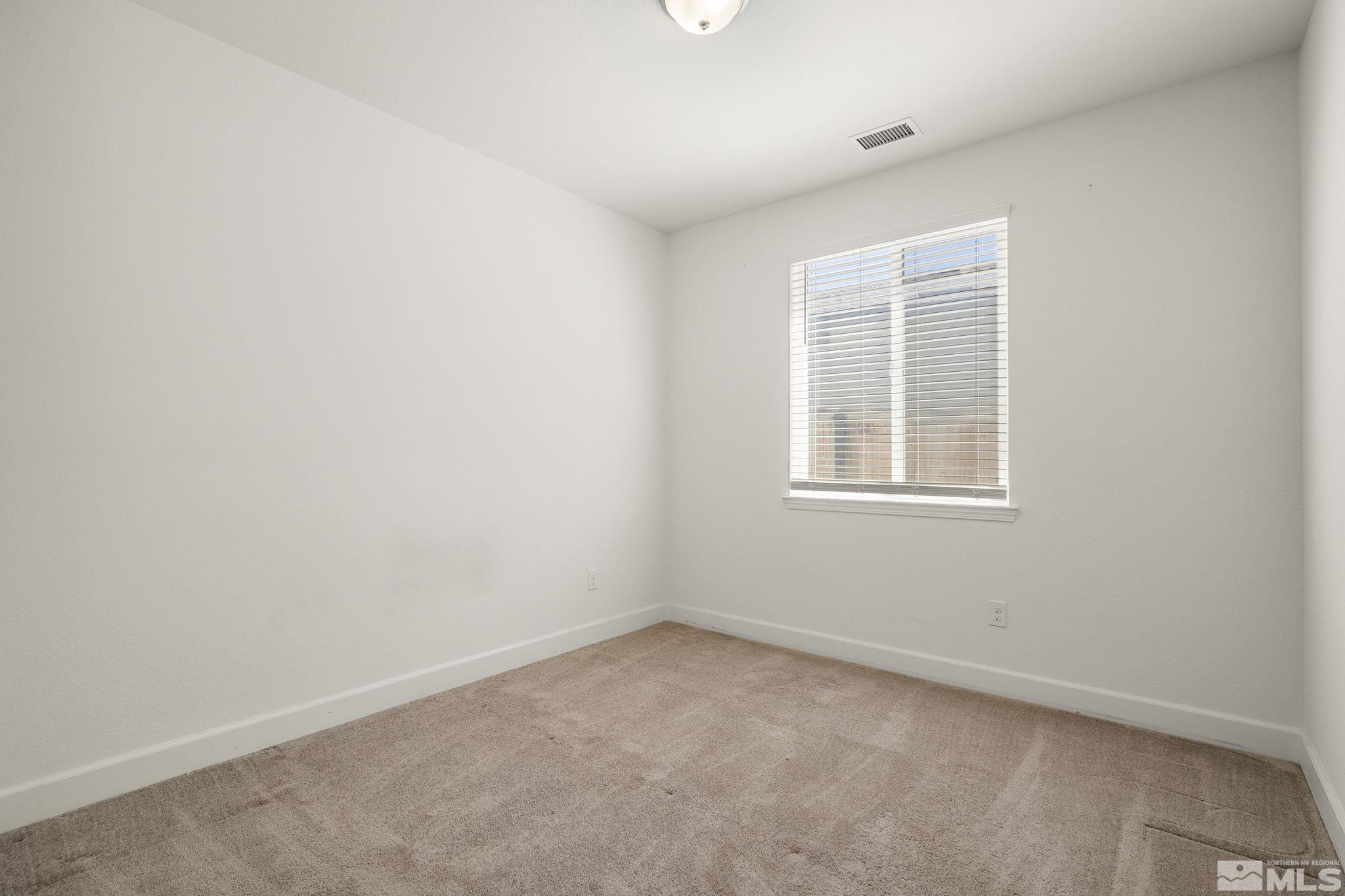7360 Continuum Drive Reno, NV 89506 - Photo 20 of 28 an empty room with a window