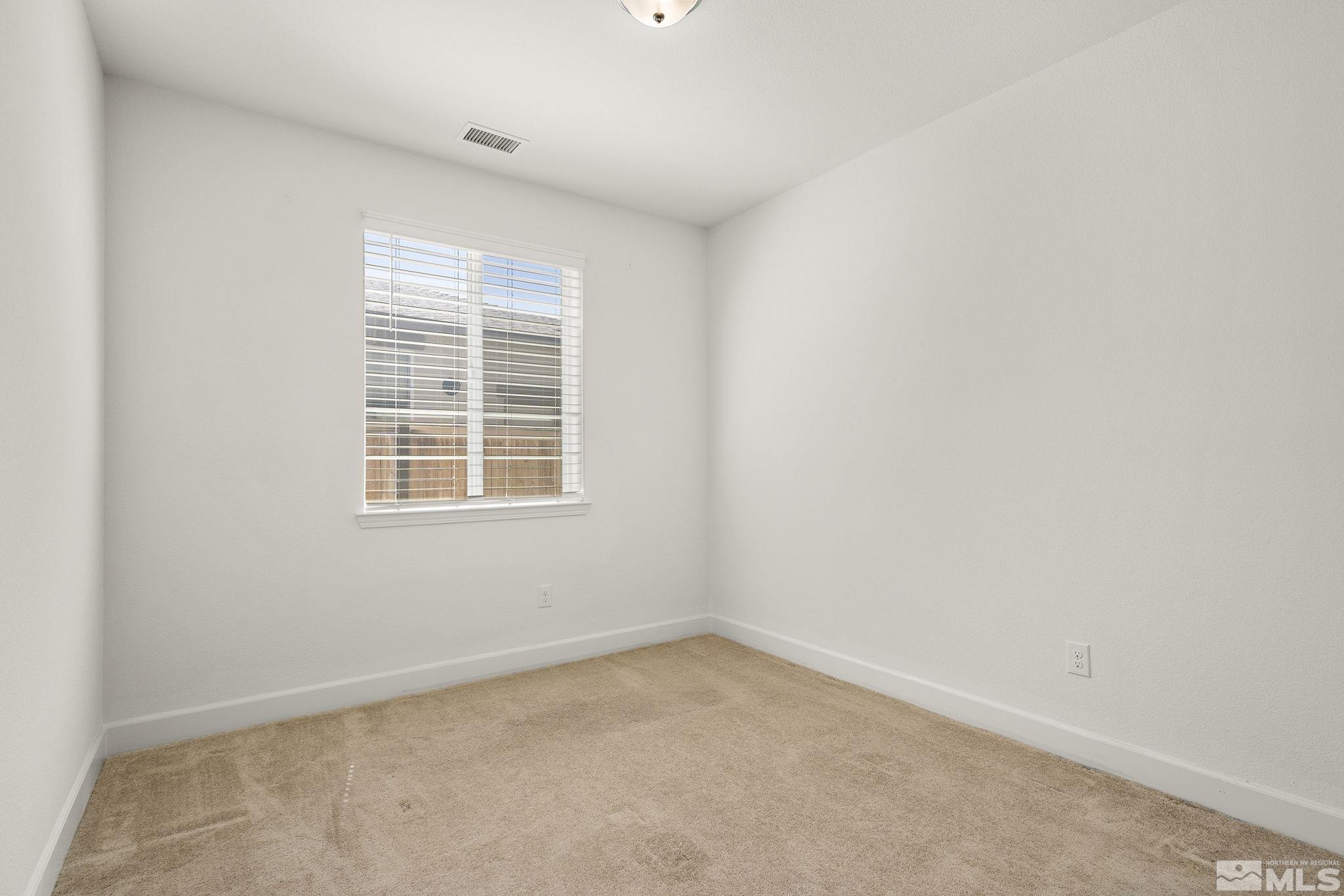 7360 Continuum Drive Reno, NV 89506 - Photo 22 of 28 an empty room with a window