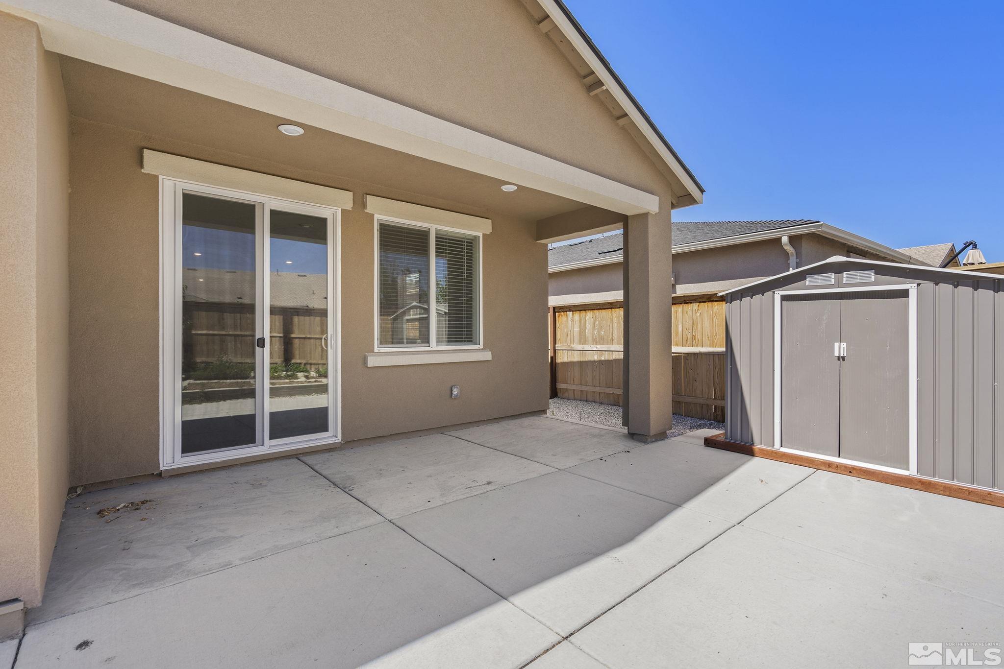7360 Continuum Drive Reno, NV 89506 - Photo 24 of 28 a view of front door with garage