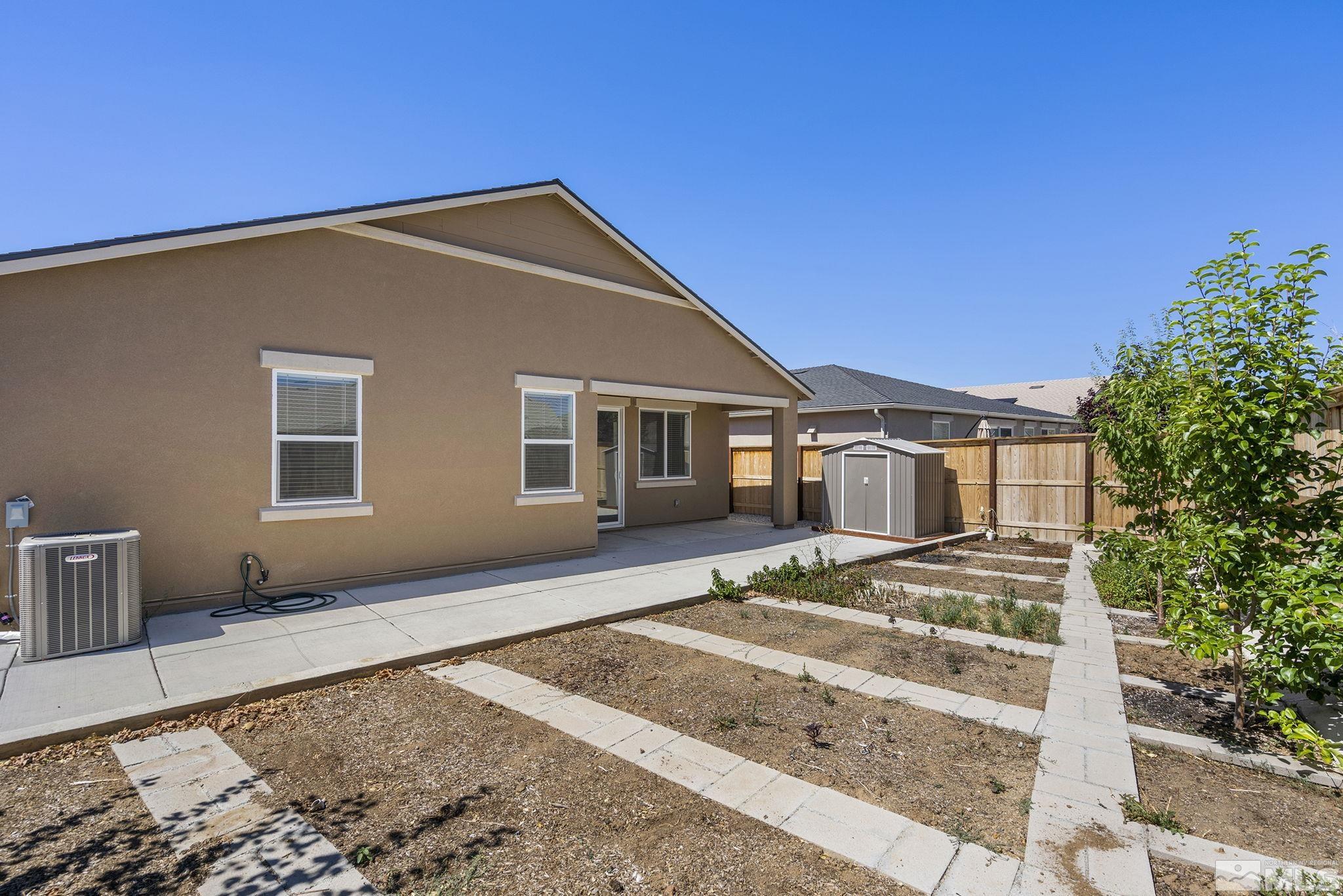 7360 Continuum Drive Reno, NV 89506 - Photo 27 of 28 a front view of a house with a garden