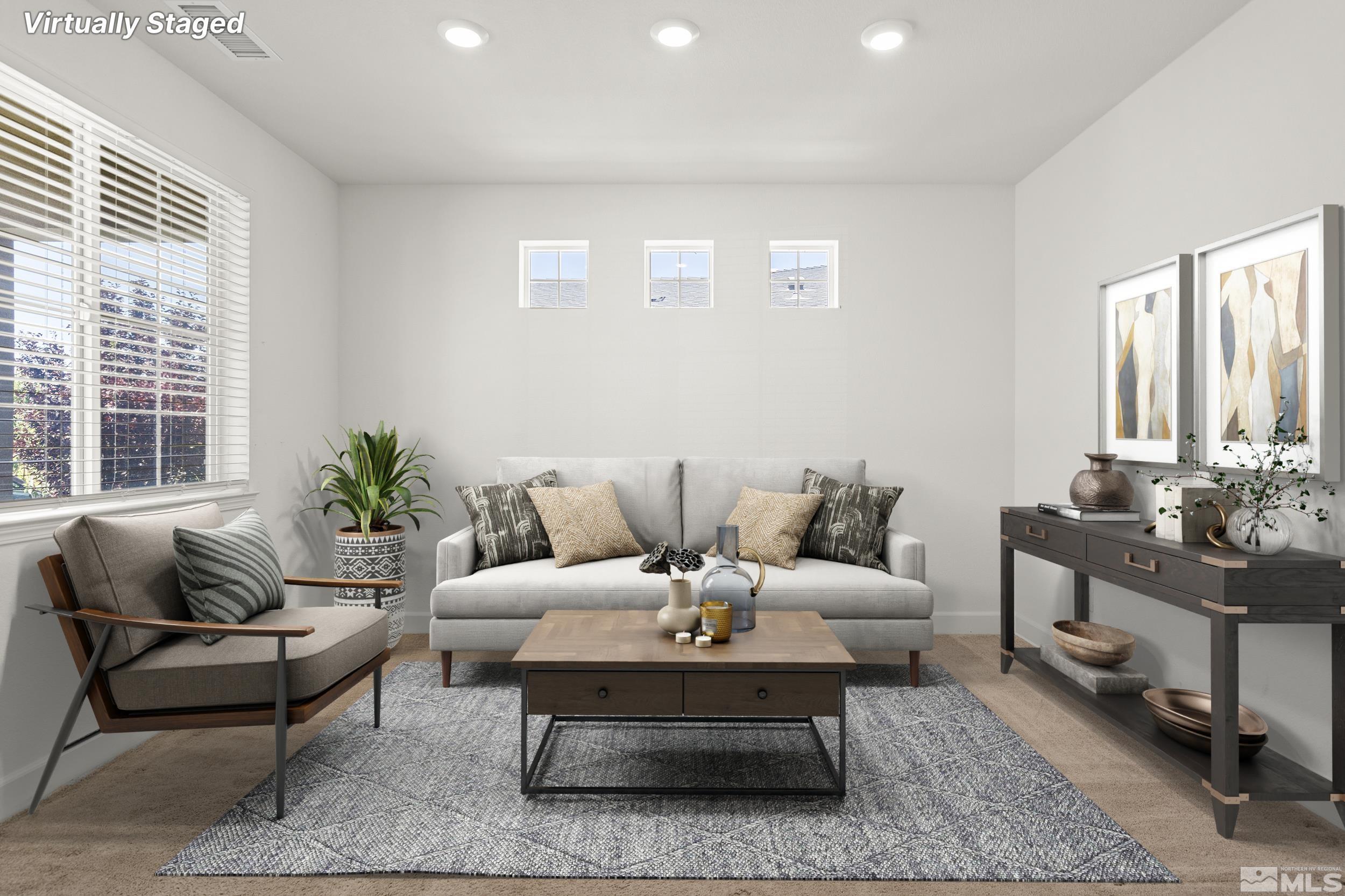 7360 Continuum Drive Reno, NV 89506 - Photo 3 of 28 a living room with furniture and a potted plant