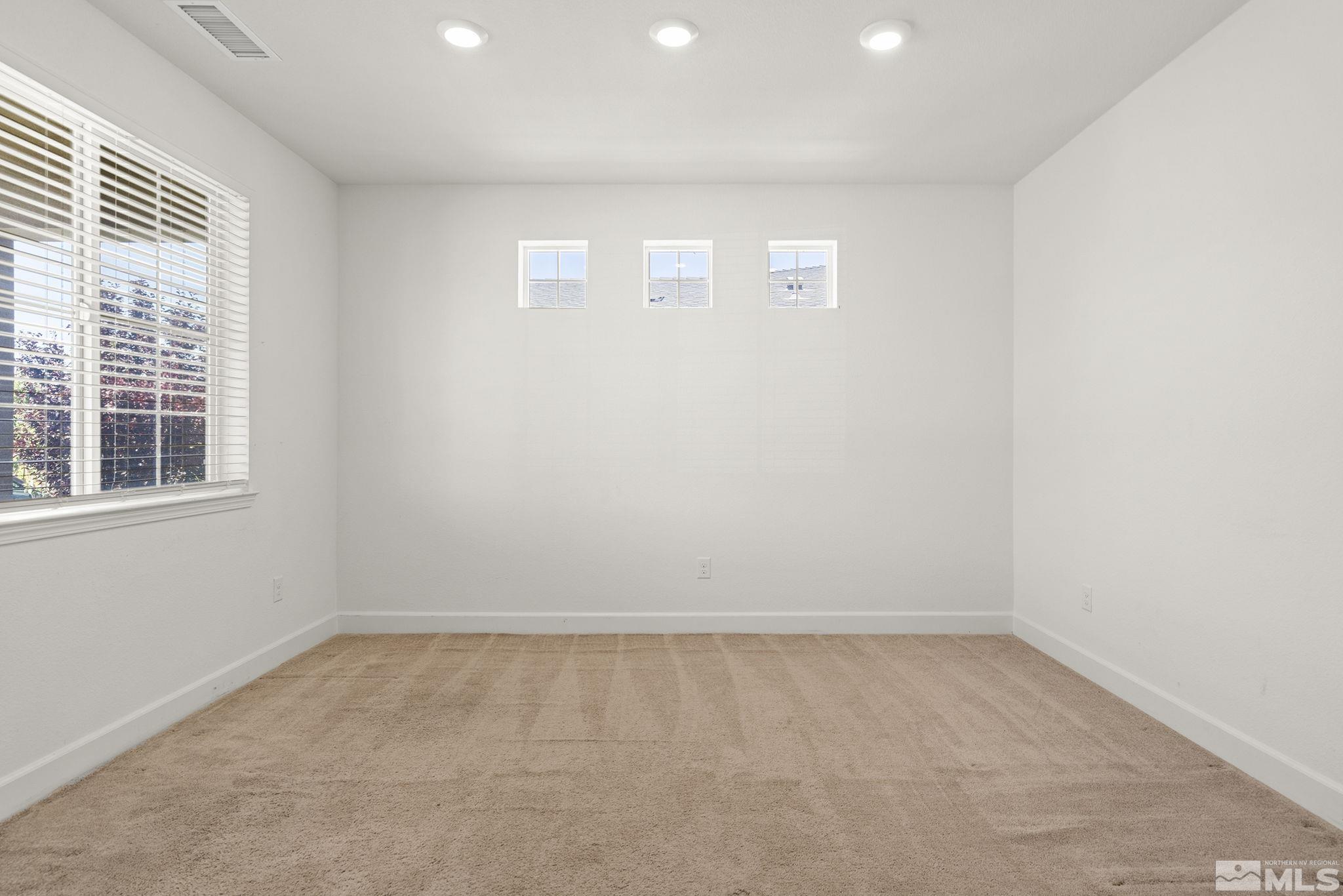 7360 Continuum Drive Reno, NV 89506 - Photo 4 of 28 an empty room with a window