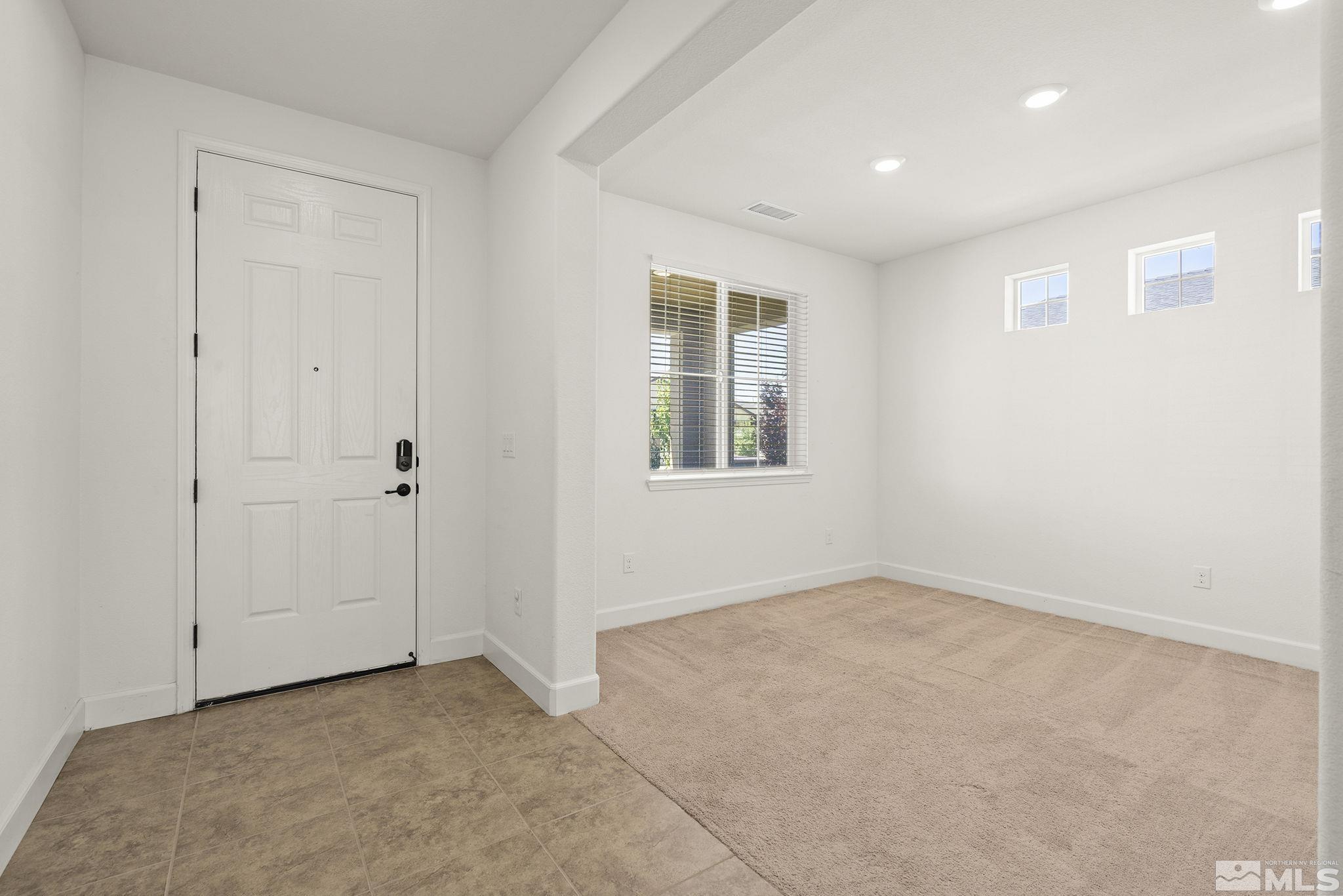 7360 Continuum Drive Reno, NV 89506 - Photo 5 of 28 an empty room with windows