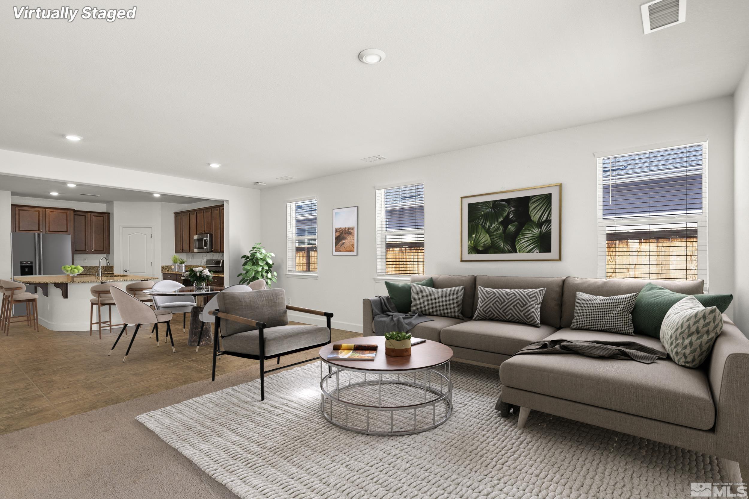 7360 Continuum Drive Reno, NV 89506 - Photo 10 of 28 a living room with furniture a rug and a window