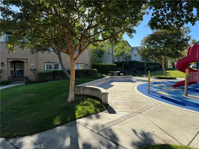 a view of a park with large trees