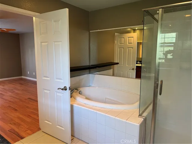 a bathroom with a tub and a sink