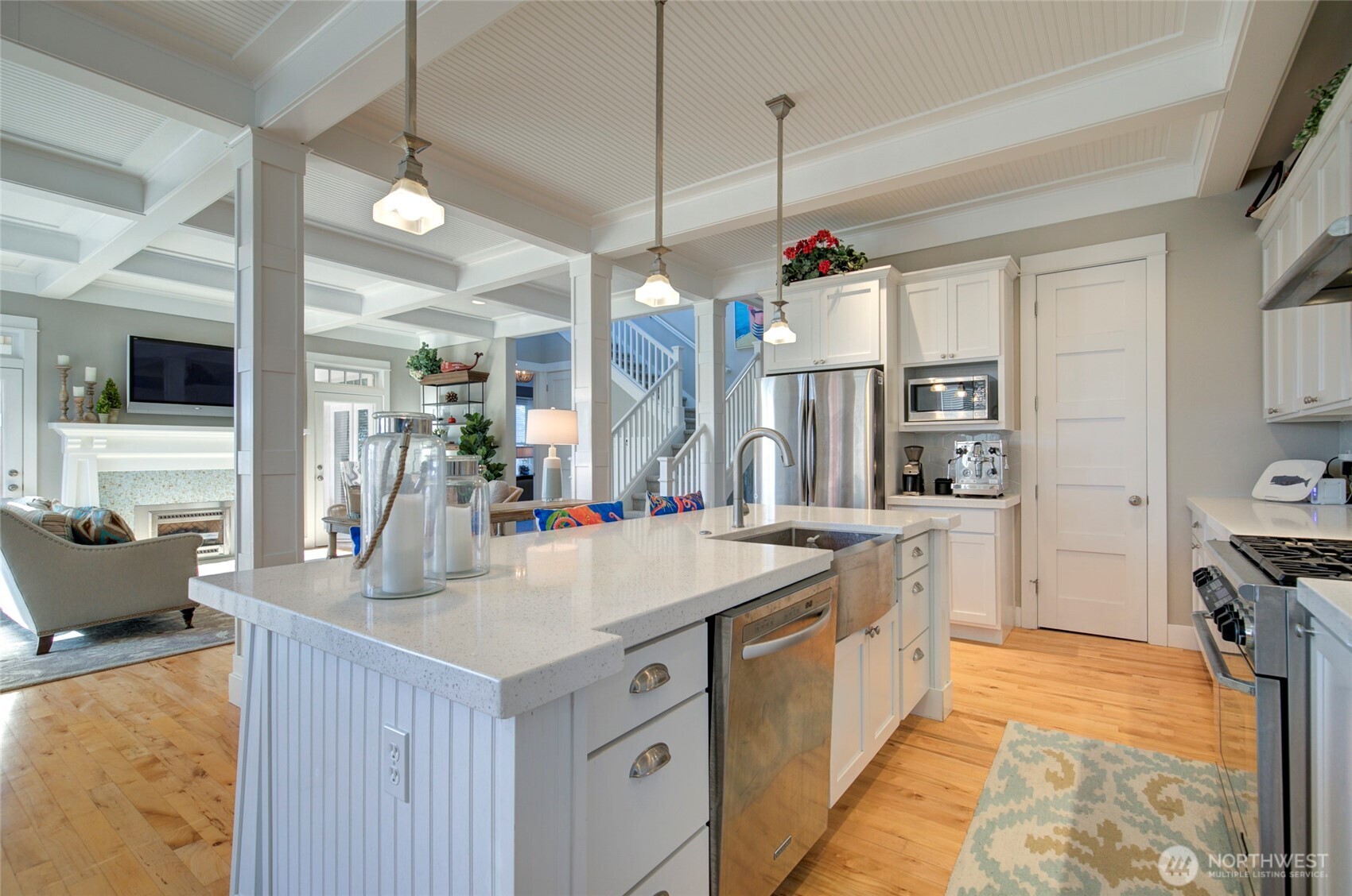 33 Fireside Lane Pacific Beach, WA 98571 - Photo 13 of 40 a large kitchen with kitchen island a stove a sink a center island and living room view