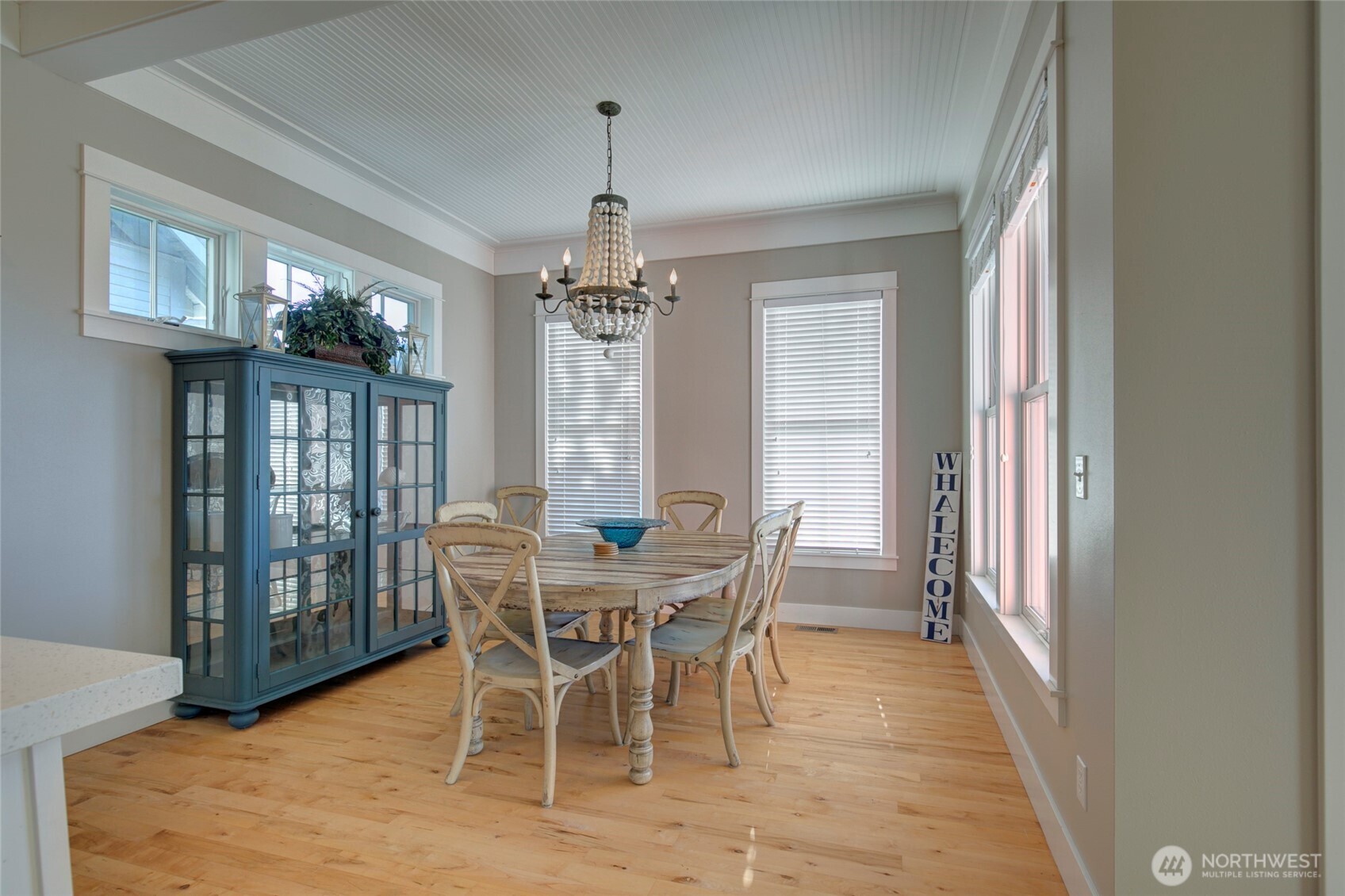 33 Fireside Lane Pacific Beach, WA 98571 - Photo 16 of 40 a view of a dining room with furniture a chandelier and wooden floor