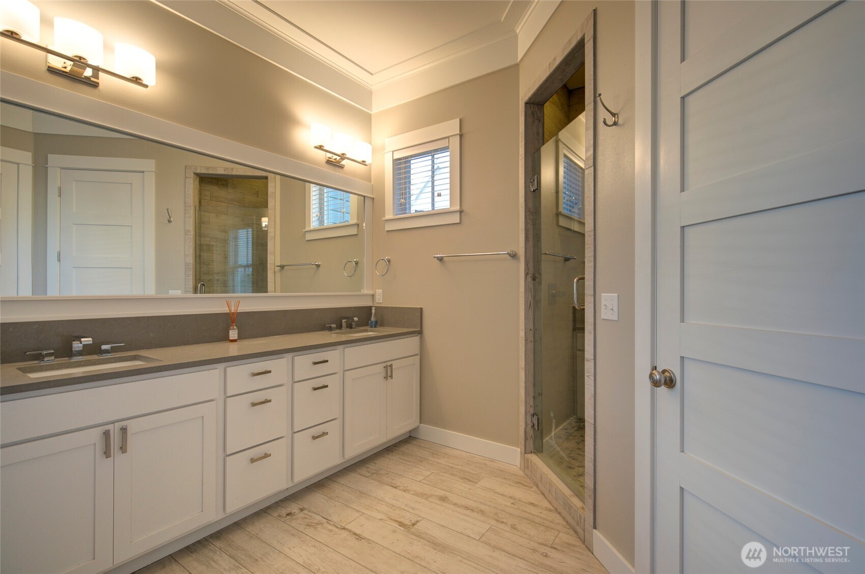 33 Fireside Lane Pacific Beach, WA 98571 - Photo 20 of 40 a bathroom with a granite countertop double vanity sink a mirror and a shower