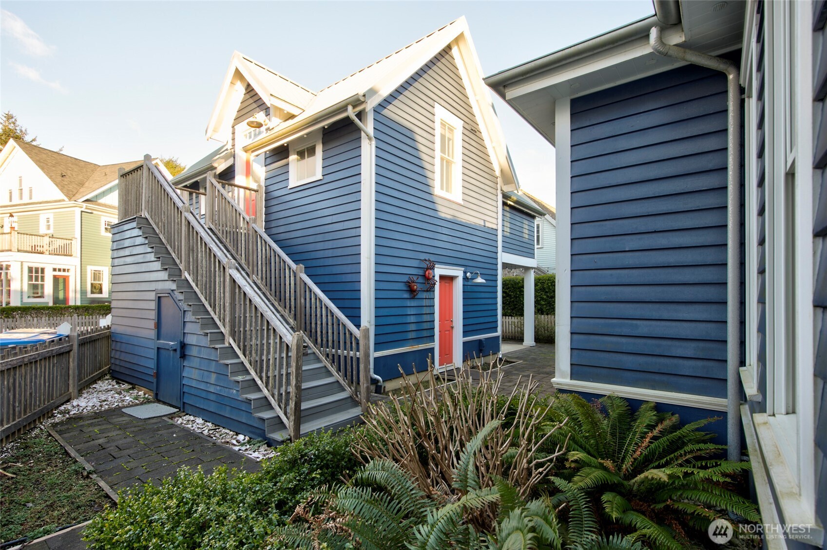33 Fireside Lane Pacific Beach, WA 98571 - Photo 28 of 40 a view of a house with wooden stairs and a small yard