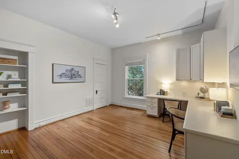 a kitchen with kitchen island a sink stove top oven and cabinets