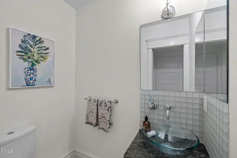 a kitchen with stainless steel appliances granite countertop a stove sink and cabinets