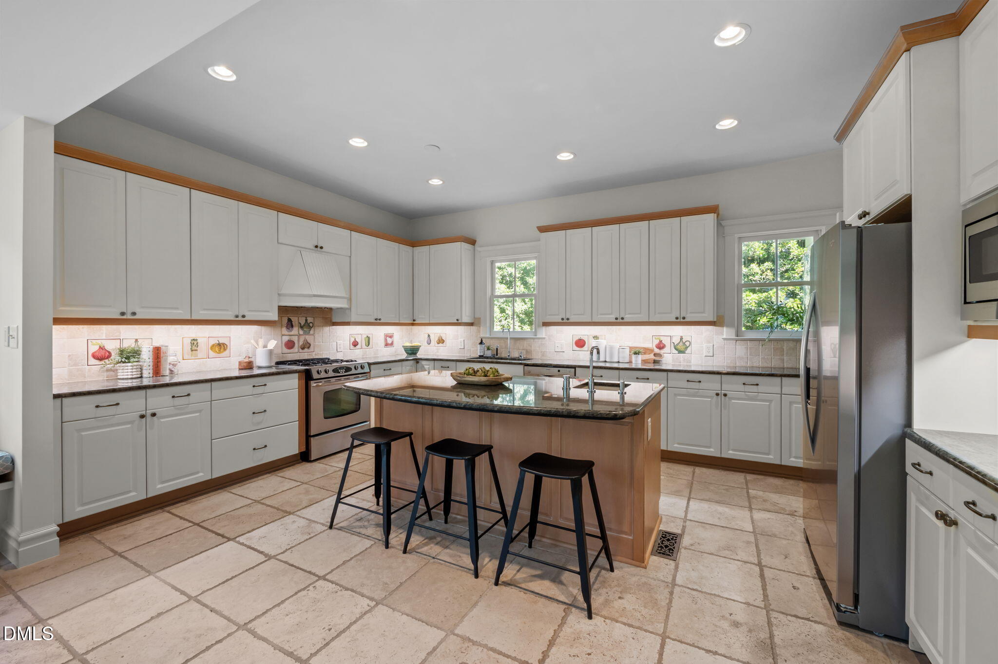 400 Ransom Street Chapel Hill, NC 27516 - Photo 27 of 67 a kitchen with cabinets appliances and a center island