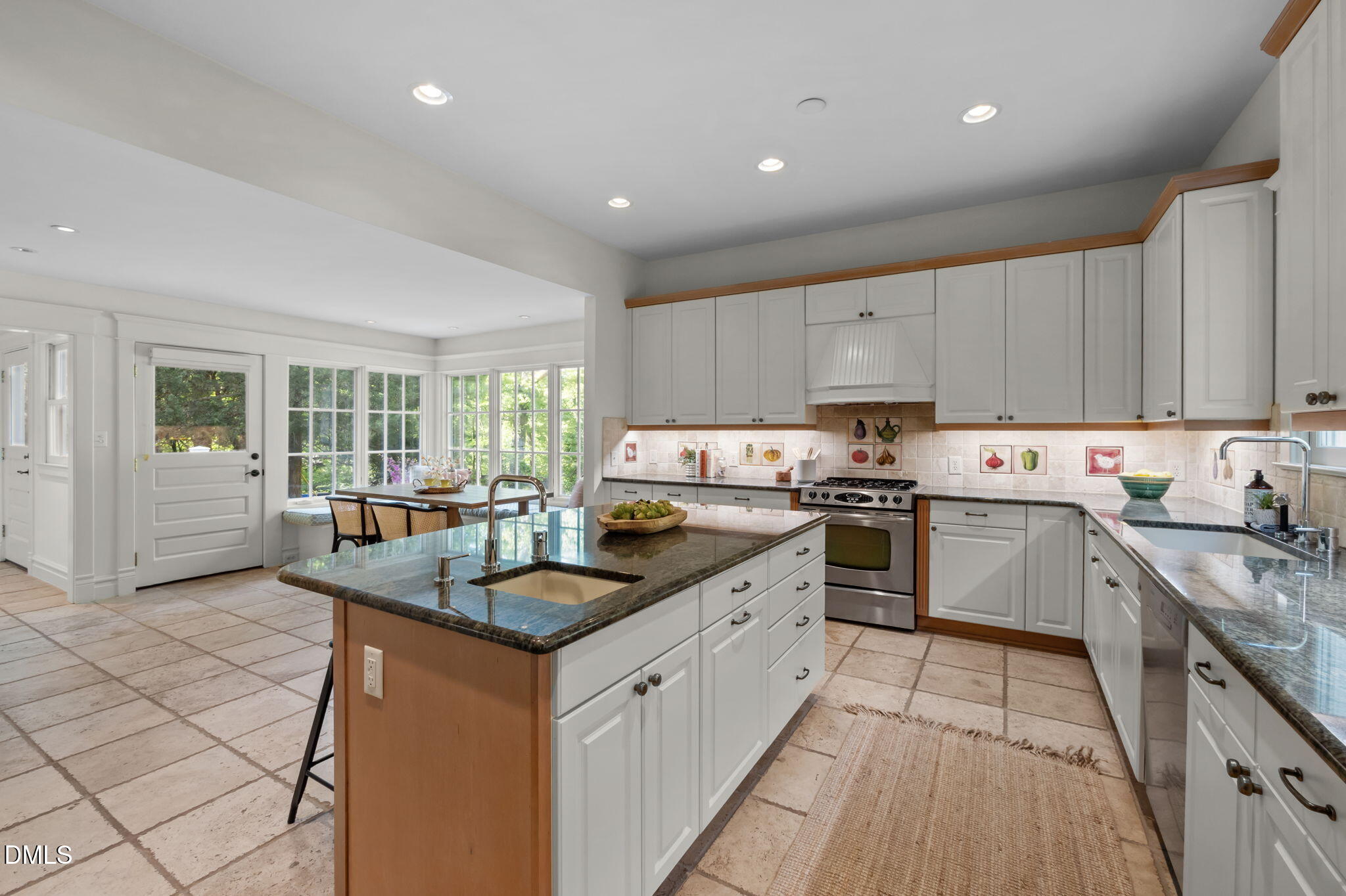 400 Ransom Street Chapel Hill, NC 27516 - Photo 31 of 67 a kitchen with stainless steel appliances granite countertop a stove sink and cabinets